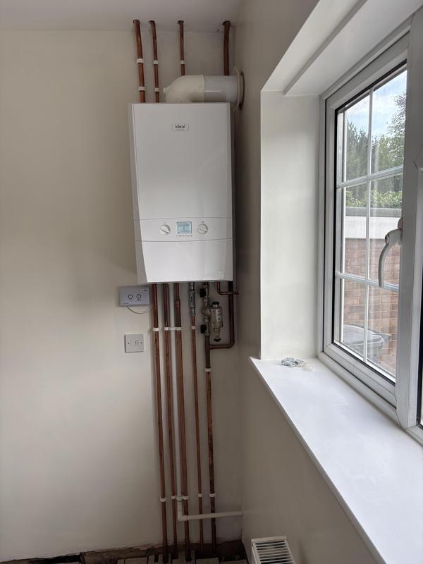 New Ideal combi boiler installation with neat copper pipework, fitted Gas Safe registered