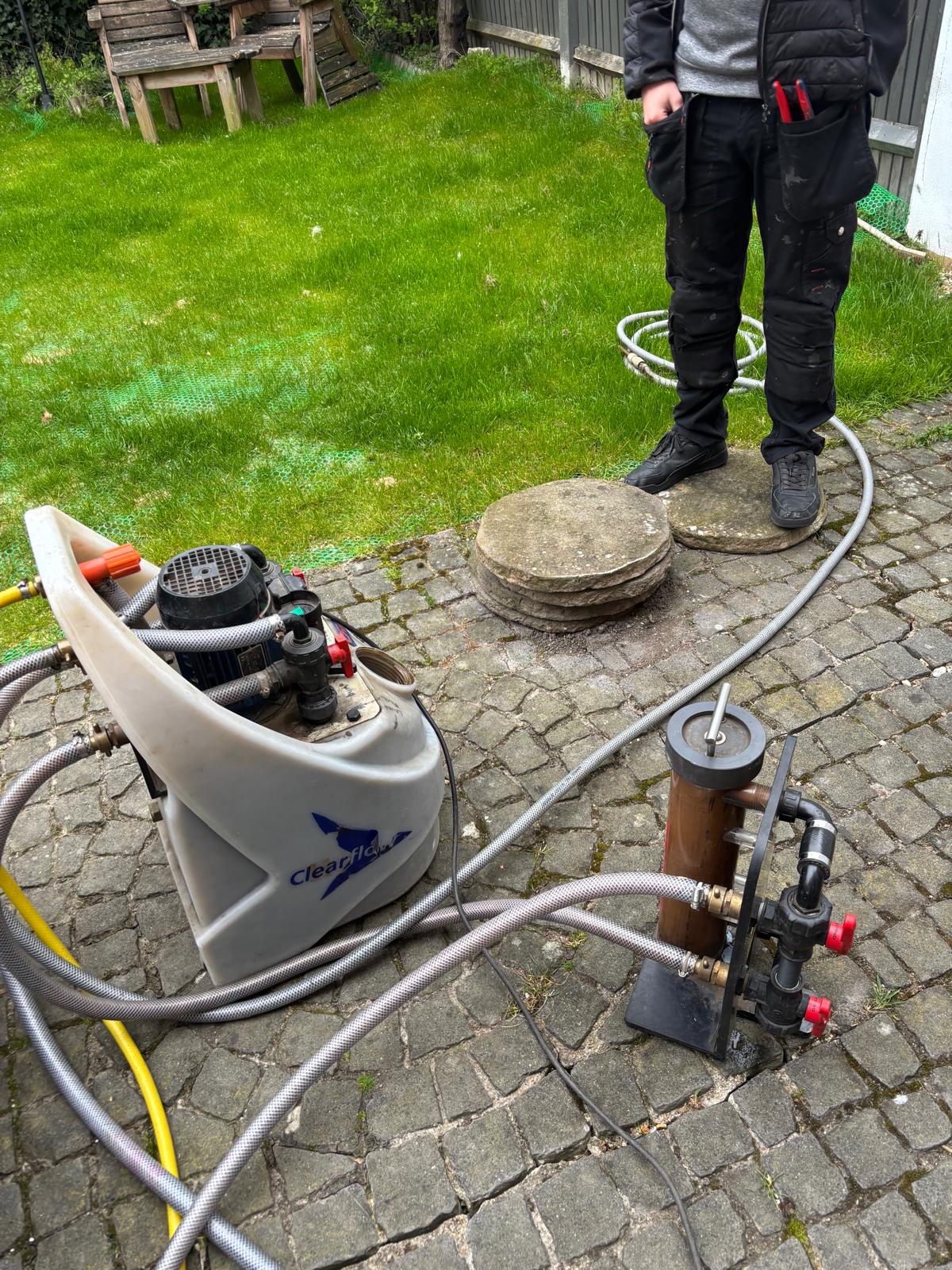 Kamco power flush pump cycling dirty brown central heating water through its sight glass