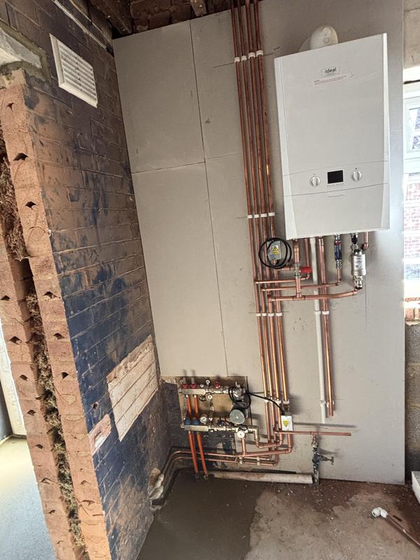 New boiler and heating system installation with fresh copper pipework and manifold by Steve Coulter